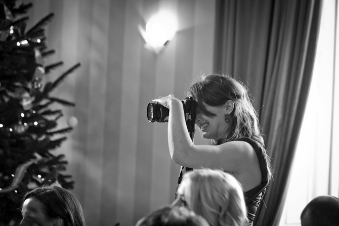 real wedding guest taking photos at ceremony
